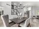 Dining area features a large dark wood table and chairs below a geometric chandelier at 1600 Windsford Cir, Las Vegas, NV 89117