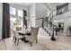 Dining area boasts high ceilings, modern light fixture, and easy access to the backyard at 1600 Windsford Cir, Las Vegas, NV 89117