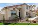 Charming two-story home featuring desert landscaping and manicured lawn at 1600 Windsford Cir, Las Vegas, NV 89117