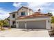 Charming two-story home featuring desert landscaping and a spacious three-car garage at 1600 Windsford Cir, Las Vegas, NV 89117