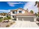 Attractive two-story home with tile roof, desert landscaping and a spacious two-car garage at 1600 Windsford Cir, Las Vegas, NV 89117