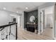 Bright hallway features modern decor, geometric wall accent, and light wood-look flooring at 1600 Windsford Cir, Las Vegas, NV 89117