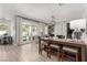 Open concept living space leads to pool with fireplace, bar, and kitchen at 1600 Windsford Cir, Las Vegas, NV 89117