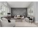 Bright and airy living room with vaulted ceilings, modern decor and wood floors at 1600 Windsford Cir, Las Vegas, NV 89117