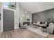 Bright and airy living room with vaulted ceilings, modern decor and wood floors at 1600 Windsford Cir, Las Vegas, NV 89117