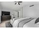 Comfortable main bedroom featuring a tv, ensuite access, and neutral decor at 1600 Windsford Cir, Las Vegas, NV 89117