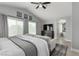 Bright main bedroom features vaulted ceilings, tv, ensuite access, and neutral decor at 1600 Windsford Cir, Las Vegas, NV 89117