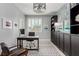Home office featuring a modern desk and chair, black built-ins, and a window at 1600 Windsford Cir, Las Vegas, NV 89117