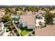 Beautiful rear exterior showcasing a sparkling pool, putting green, and lovely outdoor seating at 1600 Windsford Cir, Las Vegas, NV 89117