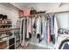 Spacious walk-in closet with plenty of shelving, shoe storage, and hanging space at 1600 Windsford Cir, Las Vegas, NV 89117
