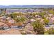 This aerial view shows a neighborhood showcasing well-maintained homes and mature trees at 2021 Summit Pointe Dr, Las Vegas, NV 89117