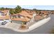 Aerial view of home displaying a terracotta roof, a three car garage, and neat landscaping highlighting curb appeal at 2021 Summit Pointe Dr, Las Vegas, NV 89117