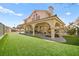 Expansive backyard featuring a covered patio perfect for entertaining and relaxation at 2021 Summit Pointe Dr, Las Vegas, NV 89117
