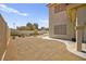 Inviting backyard oasis featuring gravel, fire pit with chairs, and charming stock tank pool for relaxation and outdoor gatherings at 2021 Summit Pointe Dr, Las Vegas, NV 89117
