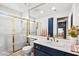 Clean, updated bathroom with a glass-enclosed shower and modern vanity at 2021 Summit Pointe Dr, Las Vegas, NV 89117