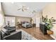Large bedroom with sitting area, ample natural light, and a view into a sunroom or gym space at 2021 Summit Pointe Dr, Las Vegas, NV 89117