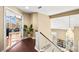 Elegant home entryway featuring an open floor plan with abundant natural light and beautiful staircase at 2021 Summit Pointe Dr, Las Vegas, NV 89117