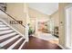 Inviting foyer with high ceilings and a staircase creates a grand entrance at 2021 Summit Pointe Dr, Las Vegas, NV 89117