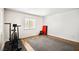 Clean and bright home gym with wood floors and a large window offering natural light and a view at 2021 Summit Pointe Dr, Las Vegas, NV 89117