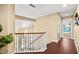 Elegant hallway with a staircase and view of the living room with a chandelier and high ceilings at 2021 Summit Pointe Dr, Las Vegas, NV 89117