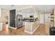 View of the kitchen with stainless steel appliances and a breakfast bar with pendant lighting at 2021 Summit Pointe Dr, Las Vegas, NV 89117