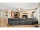 Spacious living area with a fireplace, entertainment center, and comfortable sectional sofa at 2021 Summit Pointe Dr, Las Vegas, NV 89117