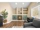 Cozy living room featuring built-in shelving, fireplace and lots of natural light creating a warm and inviting atmosphere at 2021 Summit Pointe Dr, Las Vegas, NV 89117