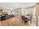 Open-concept living and dining area filled with natural light from large windows at 2021 Summit Pointe Dr, Las Vegas, NV 89117