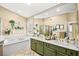 A luxurious main bathroom features double vanities, a soaking tub, and a separate shower at 2021 Summit Pointe Dr, Las Vegas, NV 89117