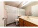 Well-maintained bathroom with modern fixtures, single sink vanity, and a shower with white curtain at 2160 Highpointe Dr # 103, Laughlin, NV 89029
