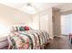 Cozy bedroom with a comfortable queen-sized bed, soft lighting, and an access to a closet at 2160 Highpointe Dr # 103, Laughlin, NV 89029