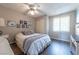 Cozy bedroom with ceiling fan, plush bedding, closet, and lots of natural light from the bright window at 2160 Highpointe Dr # 103, Laughlin, NV 89029