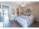 Comfortable bedroom with modern flooring, dresser with mirror, and view to the balcony and bathroom at 2160 Highpointe Dr # 103, Laughlin, NV 89029