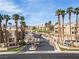 Gated condo community with lush landscaping, palm trees, and well-maintained streets at 2160 Highpointe Dr # 103, Laughlin, NV 89029