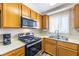 Modern kitchen featuring stainless steel appliances, a stylish range, and bright natural light at 2160 Highpointe Dr # 103, Laughlin, NV 89029