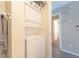 Convenient in-unit laundry area featuring a stacked washer and dryer and added towel bar for ultimate efficiency at 2160 Highpointe Dr # 103, Laughlin, NV 89029