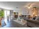 Inviting living room featuring a fireplace, ceiling fan, and lots of natural light at 2160 Highpointe Dr # 103, Laughlin, NV 89029