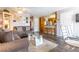 Comfortable living area with laminate floors, warm lighting, and a view into the kitchen at 2160 Highpointe Dr # 103, Laughlin, NV 89029