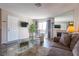 Inviting living room featuring modern furniture, fireplace, and access to a balcony with natural light at 2160 Highpointe Dr # 103, Laughlin, NV 89029