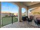 Covered patio featuring outdoor seating and a view of the lush backyard with a pool and lounge area at 258 Castellari Dr, Las Vegas, NV 89138