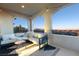 Inviting balcony with comfortable seating, stylish decor, and stunning panoramic views at 258 Castellari Dr, Las Vegas, NV 89138