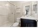 Bathroom featuring a shower with glass door, modern vanity, toilet, and decor shelving at 258 Castellari Dr, Las Vegas, NV 89138
