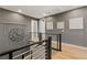 Upstairs hallway with modern railings, wood floors, stylish wall decor, and neutral paint at 258 Castellari Dr, Las Vegas, NV 89138