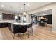 Open kitchen featuring a large island with seating, seamlessly connected to the dining and living area at 258 Castellari Dr, Las Vegas, NV 89138