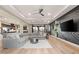 Spacious living room with a large sectional, hardwood floors, and an open concept design at 258 Castellari Dr, Las Vegas, NV 89138