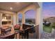 Beautiful outdoor living space on a covered patio with outdoor furniture and a backyard view at 258 Castellari Dr, Las Vegas, NV 89138