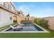 Backyard pool with two tanning chairs and privacy walls at 258 Castellari Dr, Las Vegas, NV 89138