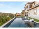 Relaxing backyard pool with tanning chairs and lush landscaping for serene outdoor living at 258 Castellari Dr, Las Vegas, NV 89138
