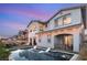 Dusk view of a pristine backyard pool, perfect for evening relaxation and entertainment at 258 Castellari Dr, Las Vegas, NV 89138