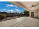 Covered backyard patio with ceiling fan overlooking a landscaped zen garden at 2603 Savannah Springs Ave, Henderson, NV 89052